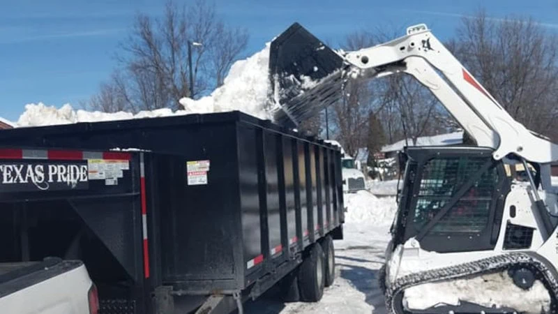 A snow-covered driveway ready for professional snow plowing services.